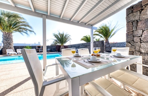 Playa Blanca Ski Chalet | Blue Waves House - Heated Pool, BBQ and Bicycles By Lanzarote Vacation Homes