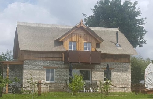Born auf dem Darss House | Boddenkutter - Bodden view, sauna, pool table, dart board, terrace, balcony, gas fireplace, barbecue, playground, garden, sun loungers, WLAN, bicycle shed
