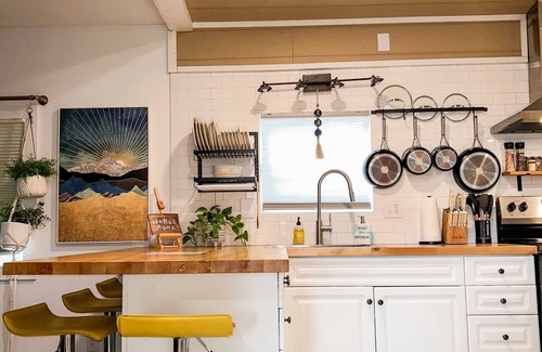 Emerald Isle House | Boho, plant-filled home w/wood + leather touches, 3 beds, 2 baths, super clean.