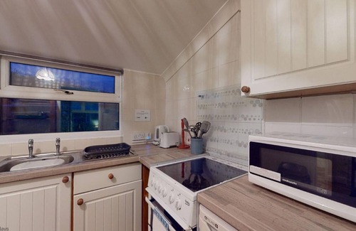 Hayle Ski Chalet | Bojago soaks up the evening sun, which can be enjoyed from an elevated rear garden. Sea Views.