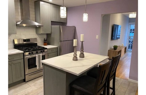 Ditmars Steinway House | Brand New 4-Bedroom Duplex with Parking and Yard-Short term stays available