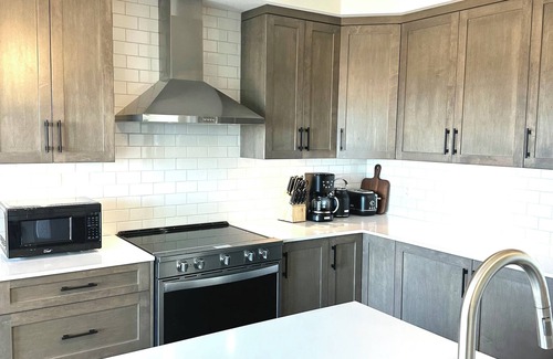 Big White Ski Resort Condo | Brand new ski in/ski out condo with mountain view and hot tub