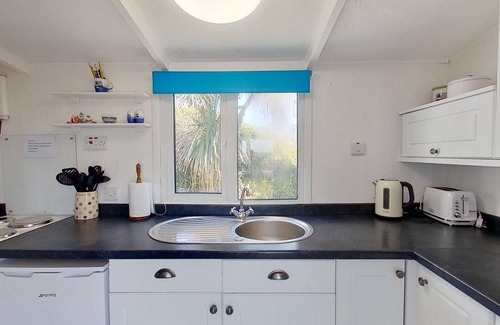 Hayle Ski Chalet | Branksome enjoys lovely sea views from its enclosed deck and also has front and rear gardens.