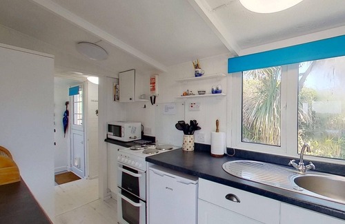 Hayle Ski Chalet | Branksome enjoys lovely sea views from its enclosed deck and also has front and rear gardens.