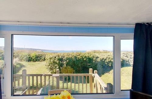 Hayle Ski Chalet | Branksome enjoys lovely sea views from its enclosed deck and also has front and rear gardens.