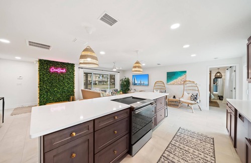 Venetian Way House | Bright and Beachy Pool Home