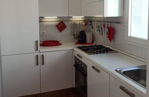 Cagnola Apartment | Bright and modern one-bedroom apartment with terrace.