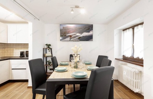 Paquier Apartment | Bright apartment in the town center with ski storage and communal parking.