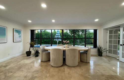 South Corals Villa | Bright Fort Lauderdale Villa with Private Heated Pool, Modern Décor and Palm-Lined Outdoor Oasis