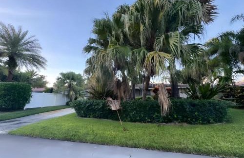 South Corals Villa | Bright Fort Lauderdale Villa with Private Heated Pool, Modern Décor and Palm-Lined Outdoor Oasis