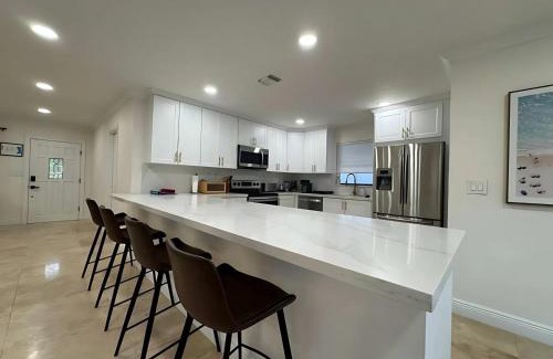 South Corals Villa | Bright Fort Lauderdale Villa with Private Heated Pool, Modern Décor and Palm-Lined Outdoor Oasis