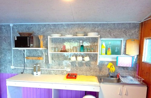 Bahia Mansa Cabin | Cabaña Maicolpue Rio Sur has a large terrace with beautiful ocean view.