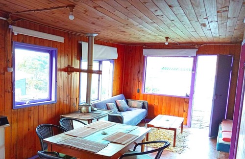 Bahia Mansa Cabin | Cabaña Maicolpue Rio Sur has a large terrace with beautiful ocean view.