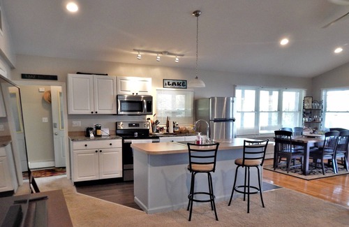 Seneca Falls House | Calm on Cayuga. Lakefront home on Cayuga Lake with dock and screened in porch