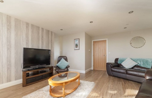 Port Saint Mary Apartment | Carrick Bay is a ground floor apartment and enjoys spectacular views of Port St Mary Bay and beyond.