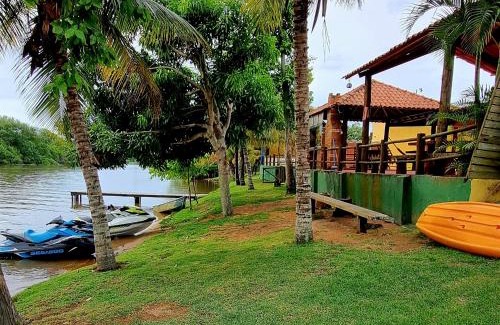 Mariricu House | CASA AMARELA Beira Rio Guriri