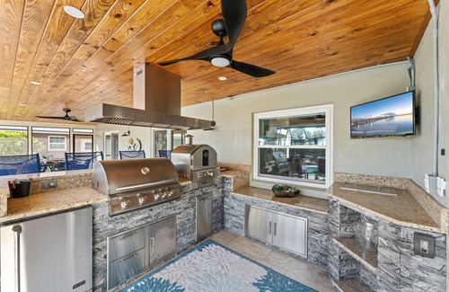 Cocoa Isles Country Club House | Casa Coco Retreat w/Heated Pool & Outdoor Kitchen!
