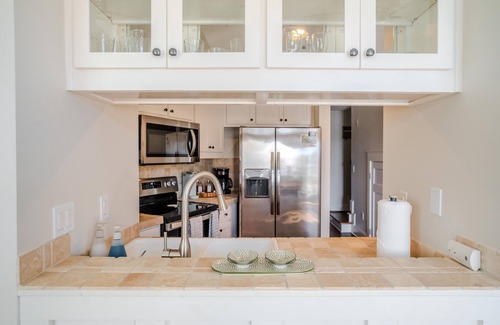 Sunnyside Condo | Castaway Condo, beach chairs w/wagon provided, 4 pools, dedicated workspace.