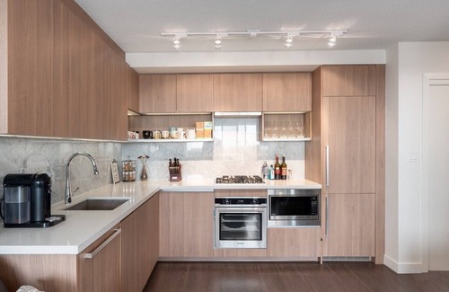 Surrey Condo | Centrally located, 30 plus floor Rocky Mountains view 1 BR Condo