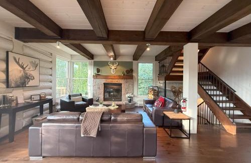 Lac Superieur Village Ski Chalet | Chalet Inukshuk Luxury Log Cabin with Spa Lake View and Club Access near Mont Tremblant