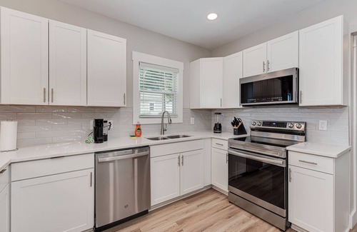 Charlotte House | Charlotte 5 Bedroom Home with Hot Tub, Patio and Games! Near Uptown & Airport!