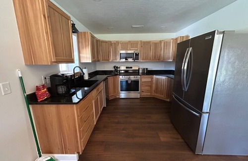Logan Cabin | Charming 2-bedroom cabin with AC, WiFi, hot tub, and firepit in beautiful Logan