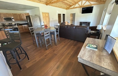 Logan Cabin | Charming 2-bedroom cabin with AC, WiFi, hot tub, and firepit in beautiful Logan