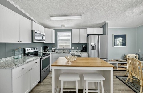 Hutchinson Island South House | Charming 2-bedroom, 2-bath beach house with private beach access, dog friendly.