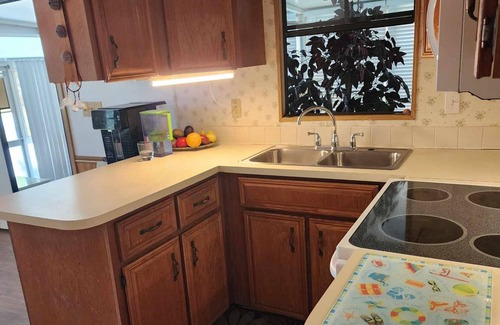 Bell Villa House | Charming bungalow with AC and WiFi in gorgeous Bonita Springs 55+ community.