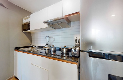 Downtown Cancun Hotel | Charming condo with kitchenette, balcony, & pool