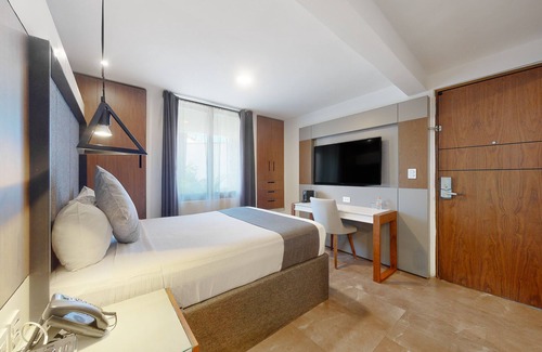 Downtown Cancun Hotel | Charming condo with kitchenette, balcony, & pool