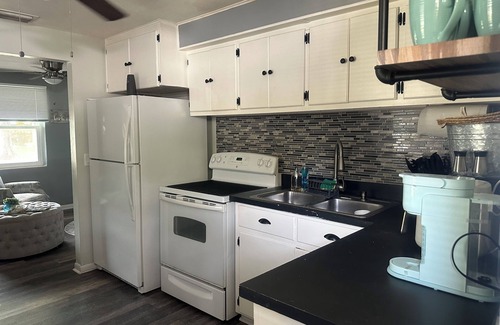 Largo House | Charming cottage sleeps 6 with jacuzzi and firepit minutes to beach pets welcome