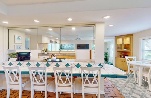 Naples Park Cottage | Charming Cottage Steps from Beach - Dog-Friendly with Bikes & Beach Gear