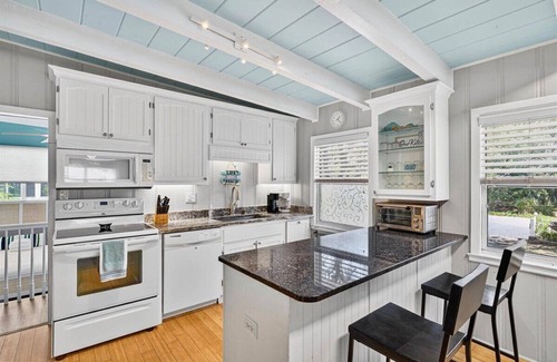 Yaupon Beach House | Charming dog-friendly bungalow, just a SHORT walk to beach Hot tub Fire Pit