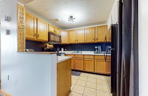 Weirs Beach Condo | Charming lakeside condo with fireplace, pool, tennis, balcony, & fast WiFi