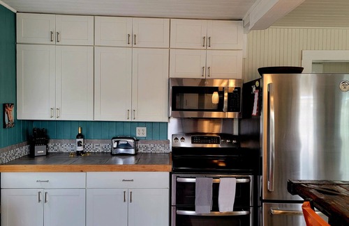 Folly Beach House | Charming Pet Friendly Oceanview Bungalow - Prime Location - Steps to Beach