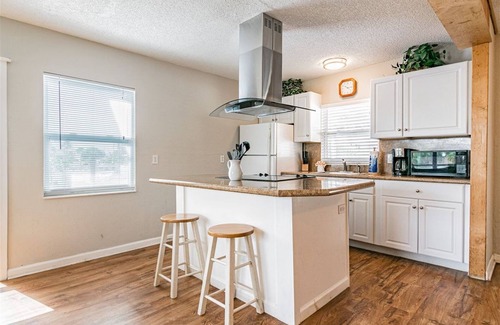 Madeira Beach Cottage | Charming Upstairs Unit in a Cottage, steps to the beach. Across from John's Pass
