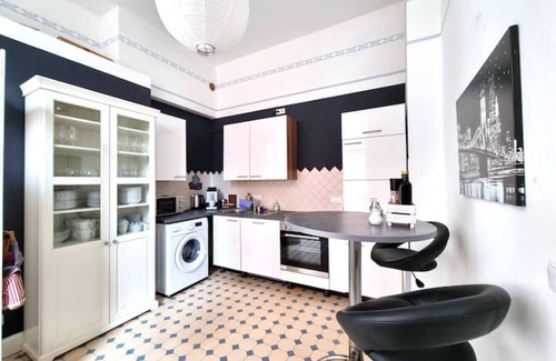 Hamelin Apartment | Charysma: Art nouveau meets modernity | darts | table football | car park
