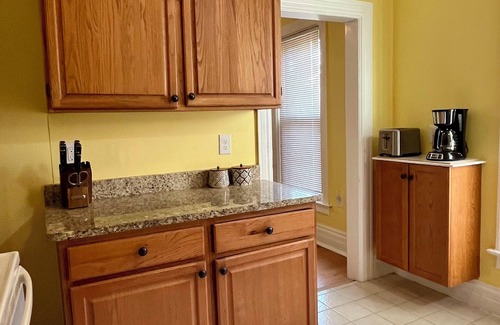 Ypsilanti Apartment | Cheerful 2BR apt, historic home near EMU and U-M, walkable area. Dog friendly!