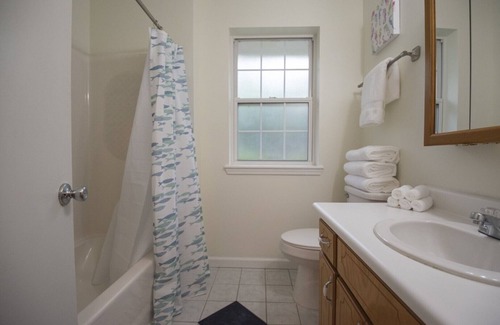 St. Marys House | Cheerful Red Brick Cottage in Downtown St. Marys!