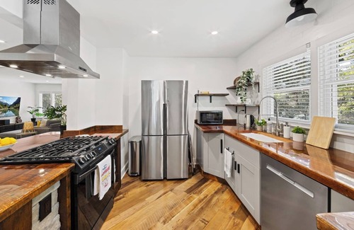 North Druid Hills House | Chef's Kitchen; King Bed, Queen & Bunk Bed, 65" TV