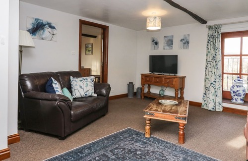 Penny Bridge Cottage | CHERRY TREE BARN, pet friendly, with open fire in Newby Bridge