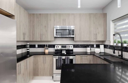 McAllen House | Chic Monochrome Living: Where Style Meets Comfort