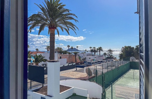 Corralejo Apartment | City Center Coastal Studio, Ocean View, Pool, WiFi