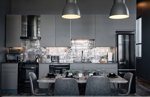 West Main Historic District Condo | City Loft Escape with River Views! By Hollyhock