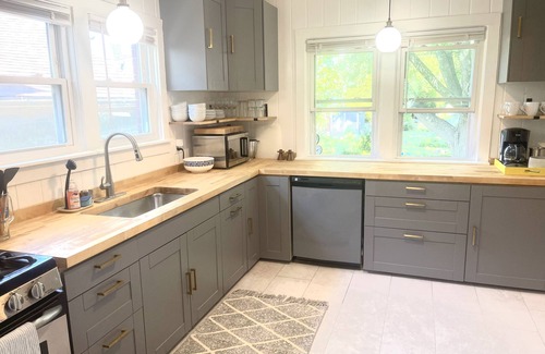 Ellis Historical District House | Classic brick charmer close to lake, river, and downtown!