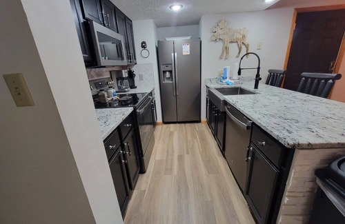 Pigeon Forge Ski Chalet | Close to Pigeon Forge- walking distance to outdoor pool-Outdoor kitchen and tv area and much more