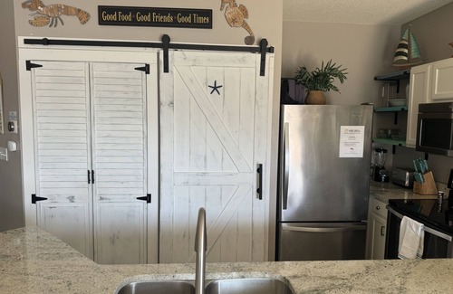 Holiday Isle Condo | Coastal Charm, pet friendly, private beach, free beach chairs service.