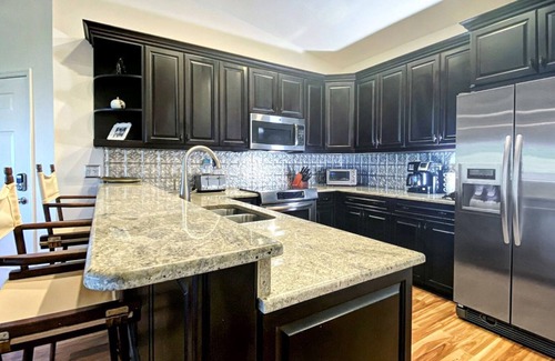 Indian Shores Condo | Coastal condo with striking sunrise & wildlife views - pool, fishing dock access