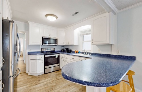 Kure Beach Cottage | Coastal cottage with short walk to the beach and fishing pier
